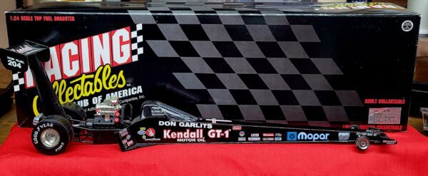 A 1992 SR 32 Kendall toy race car in front of a box.