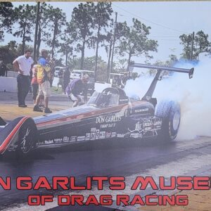 Don Garlitus Museum of Drag Racing Poster with Drag Racing in the Background