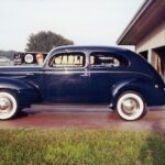 A navy blue 1940 ford blue Tudor