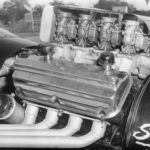 A black and white photo of a powerful car engine, perfect for drag racing enthusiasts.