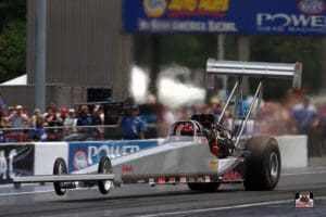 Dragster racing on a professional drag strip.