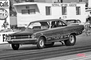 Vintage drag race car on track.