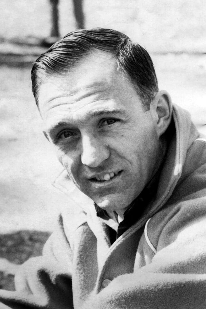 Man in a coat, looking at camera.