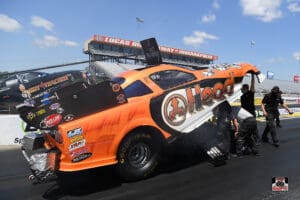 Orange race car at Lucas Oil Raceway.