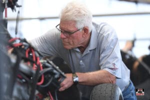 Man inspecting equipment in a workshop.