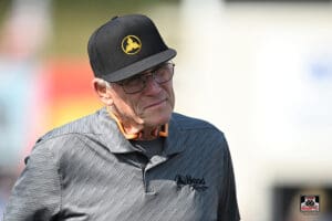 Man wearing glasses and a baseball cap.