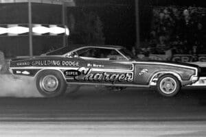 Vintage drag racing car at night race.
