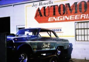 Classic car at automotive engineering shop.