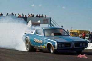 Blue drag racing car on a track.