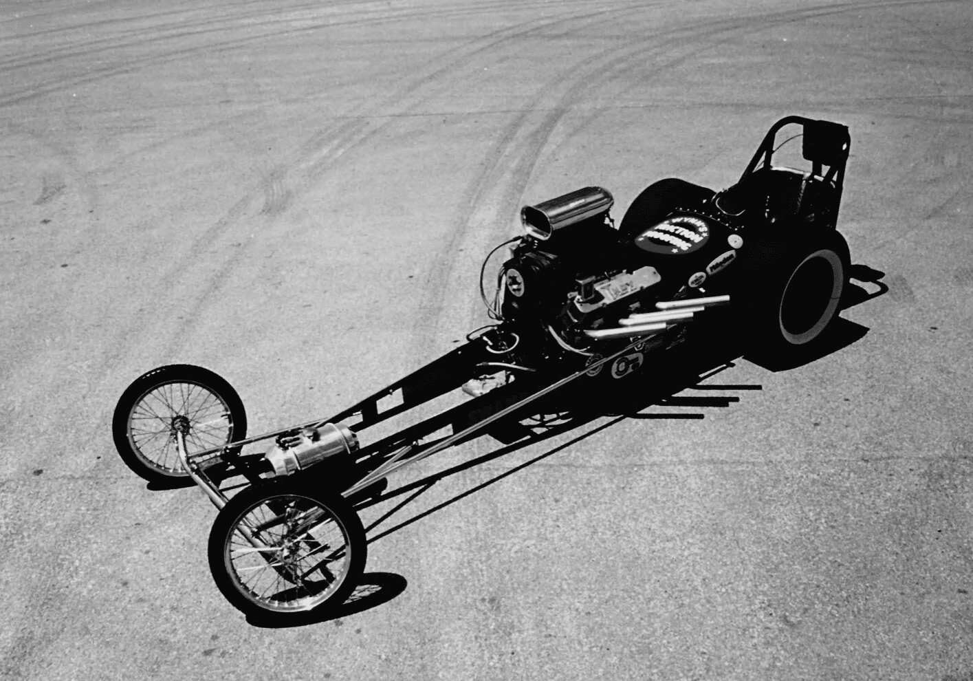 A black and white photograph of a Drag Racing car.